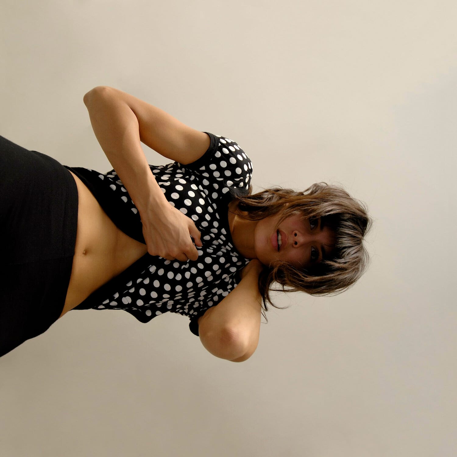 A woman in a polka-dot top, photographed sideways. afactum, 2015, Digital print on metal, Alu-Dibond, 100 x 100 cm